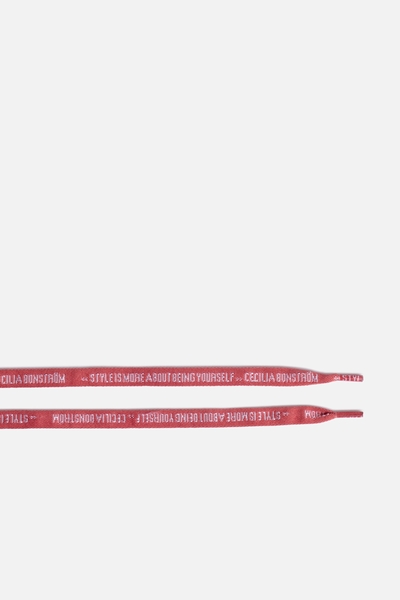 Interchangeable laces featuring the Maisons iconic slogans