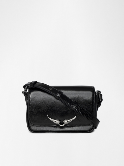 Small vintage-inspired patent leather bag with adjustable