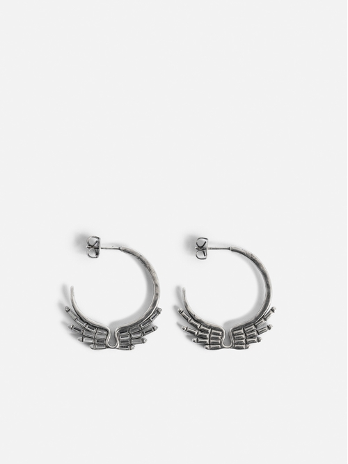 Silver-tone brass hoop earrings with diamanté wings. -