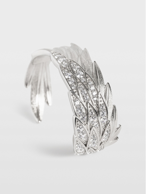 Wing-shaped brass bracelet set with rhinestones. Wing-shaped
