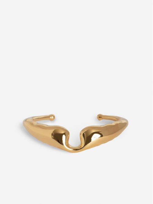 Gold Or Siler tone brass bracelet in the shape of wings. -