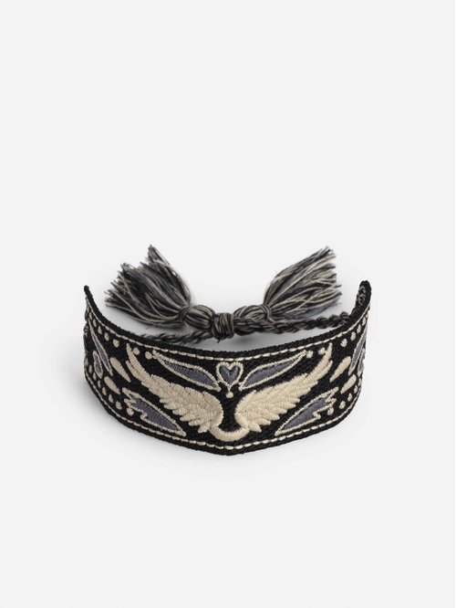 Wide woven polyester bracelet with embroidered wings. -