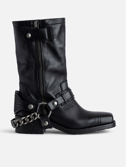 Black vegetable-tanned long ankle boots with metal chains. -