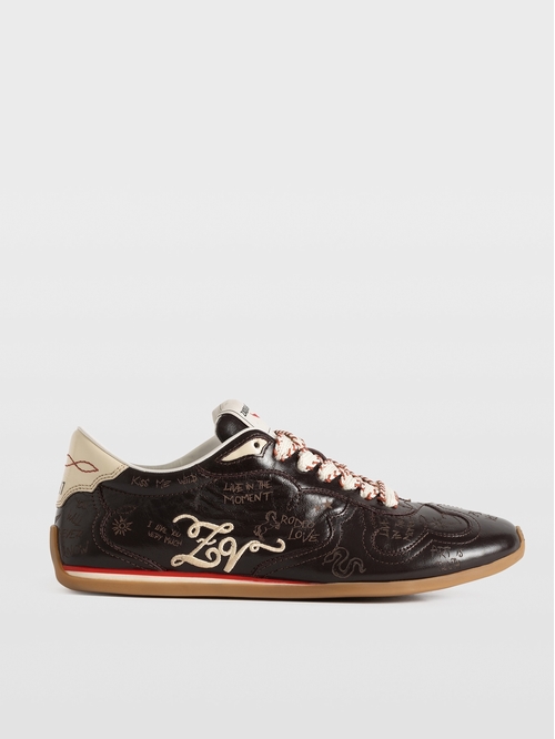 High-top sneakers in vintage leather with laser-cut graffiti