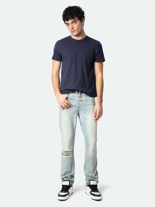 Straight jeans with holes and wear, zip fastening. -