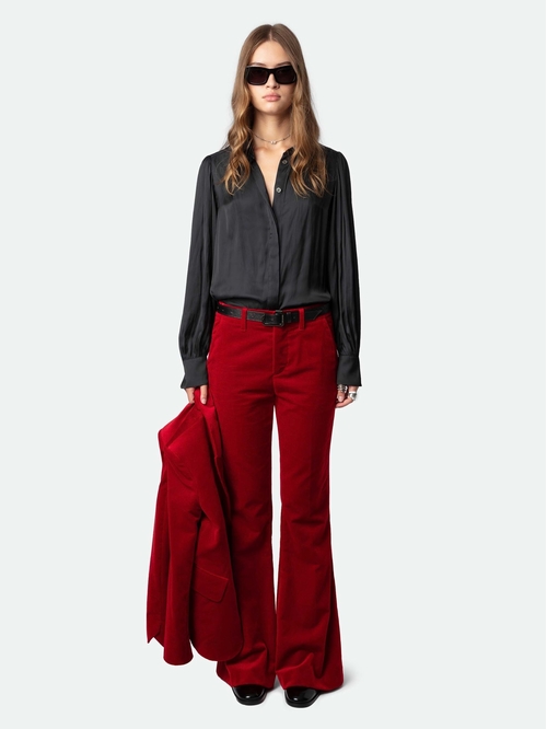 Velvet trousers with flared legs and mid-rise waist. -