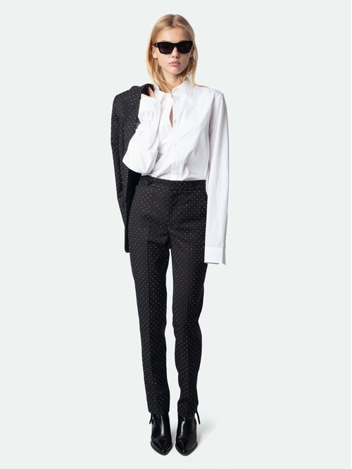 Straight-leg tailored pants with pockets and rhinestones. -