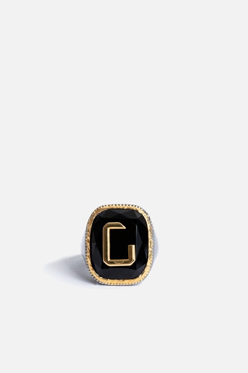 Blackened and gold-tone metal signet ring in the brands
