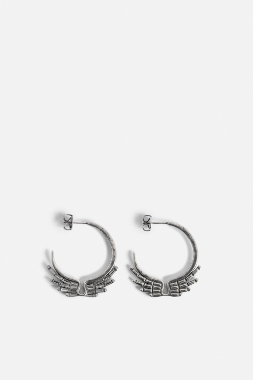 Silver-tone brass hoop earrings with diamanté wings. -