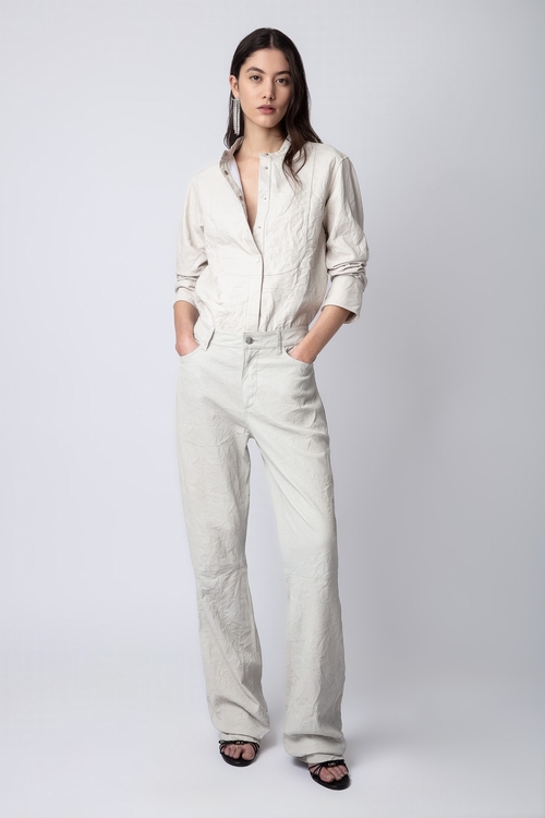 Flared tailored trousers in crinkled leather with pockets. -