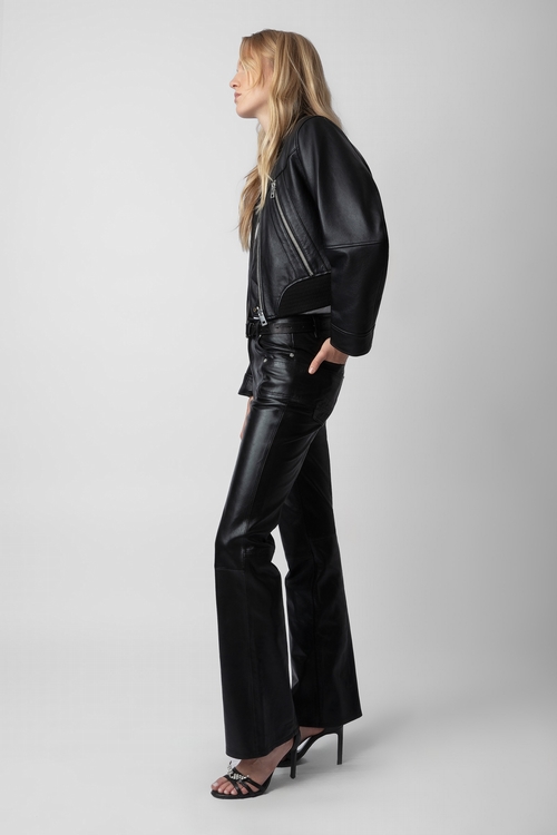 Light smooth leather trousers with flared hem and pockets. -
