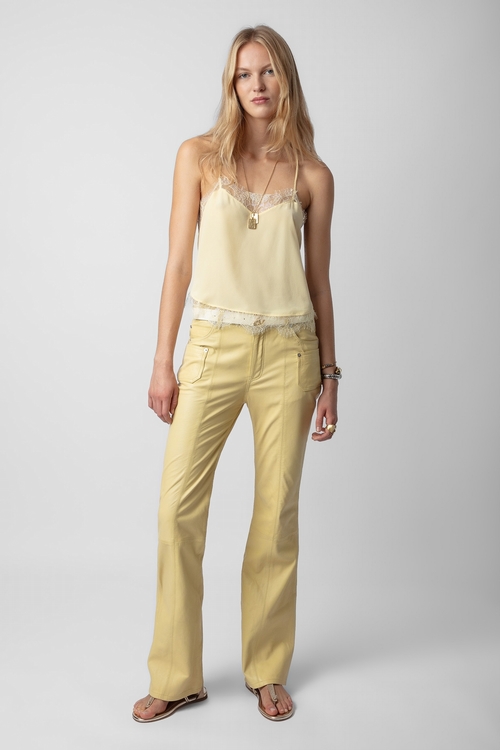Light smooth leather trousers with flared hem and pockets. -