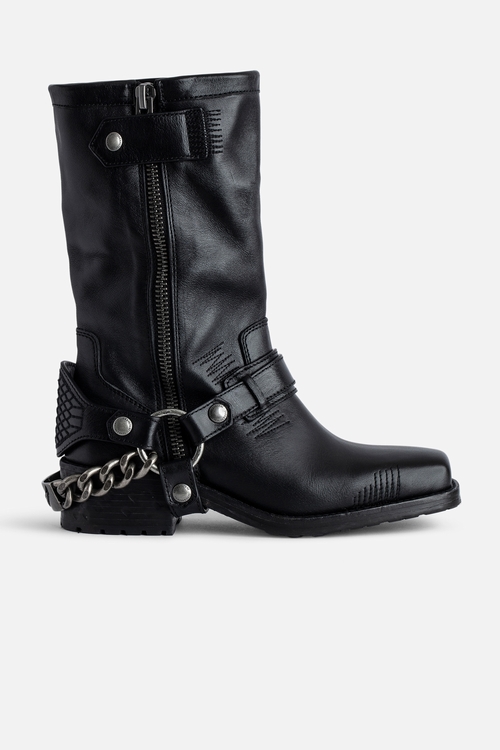 Black vegetable-tanned long ankle boots with metal chains. -