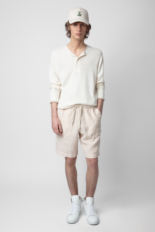 Beige washed linen Bermuda shorts with drawstring ties. -