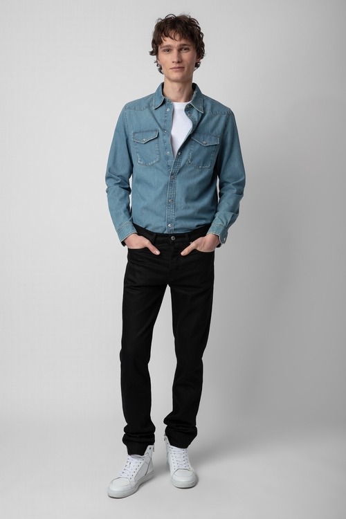 Distressed-effect blue denim shirt with long sleeves. -