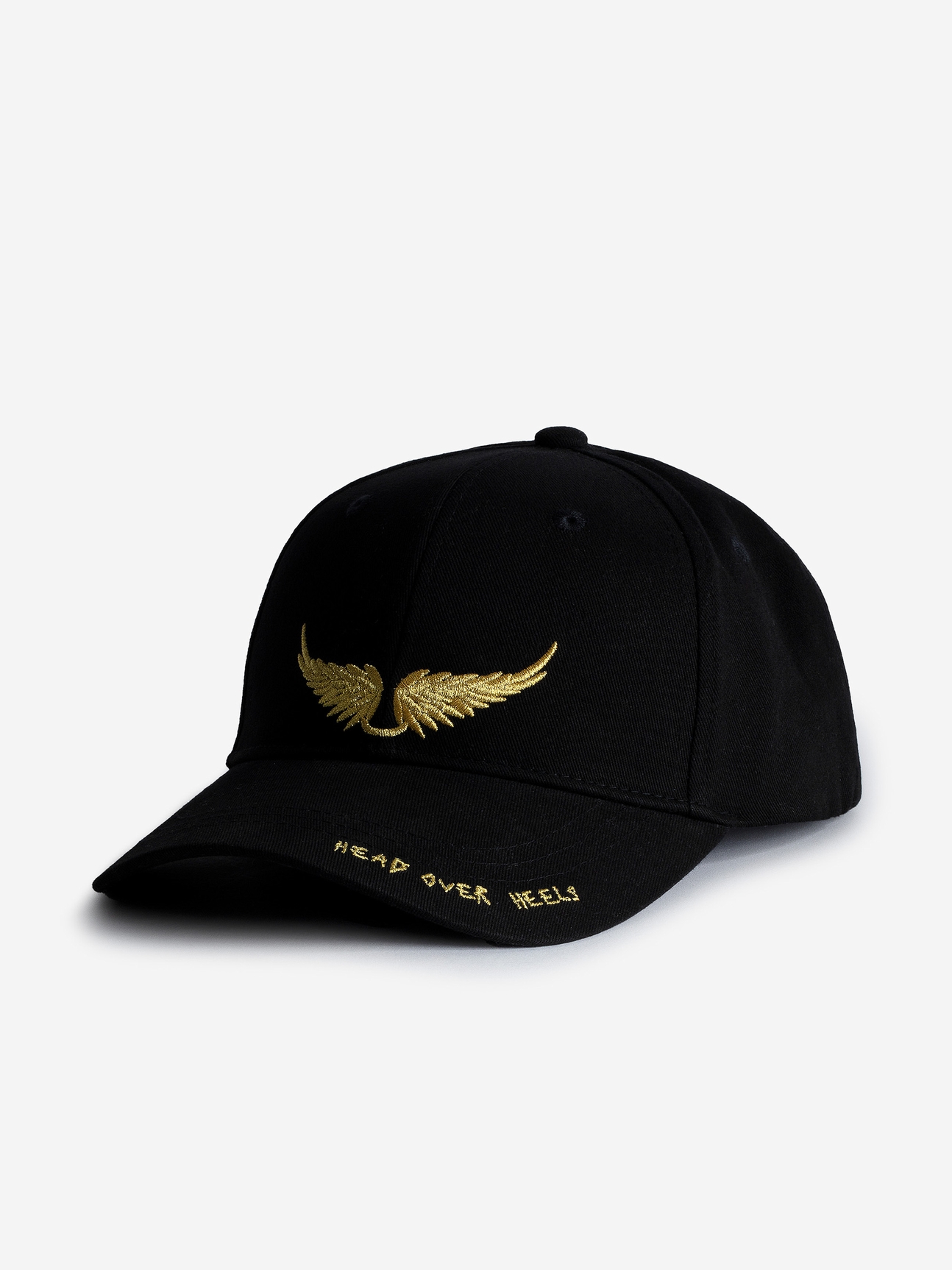 Voltaire Vice black cotton baseball cap.
The Head Over Heels Baseball Cap is part of the VOLTAIRE VICE capsule. Zadig&Voltaire is experimenting with a new creative space, where freedom is the watchword. The brand is adding its signature to everyday objects that are both practical and decorative, where design is as important as purpose.

- Black cotton baseball cap
- Gold contrasting wings embroidery on the front
- Adjustable strap
Diameter: 19 cm

Composition

100% COTTON